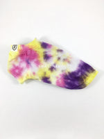 Swagadelic Spiral Tie Dye Tee - Product side view. The hand tie-dyed tee with Pink, Yellow and Purple