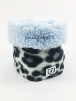 Gray Snow Leopard Swagsnood - Product Front View. Blue sherpa rolled up 1/3 of the snood and 2/3 with gray snow leopard print fleece