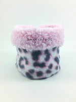 Pink Snow Leopard Swagsnood - Product Front View. Pink sherpa rolled up 1/3 of the snood and 2/3 with pink snow leopard print fleece