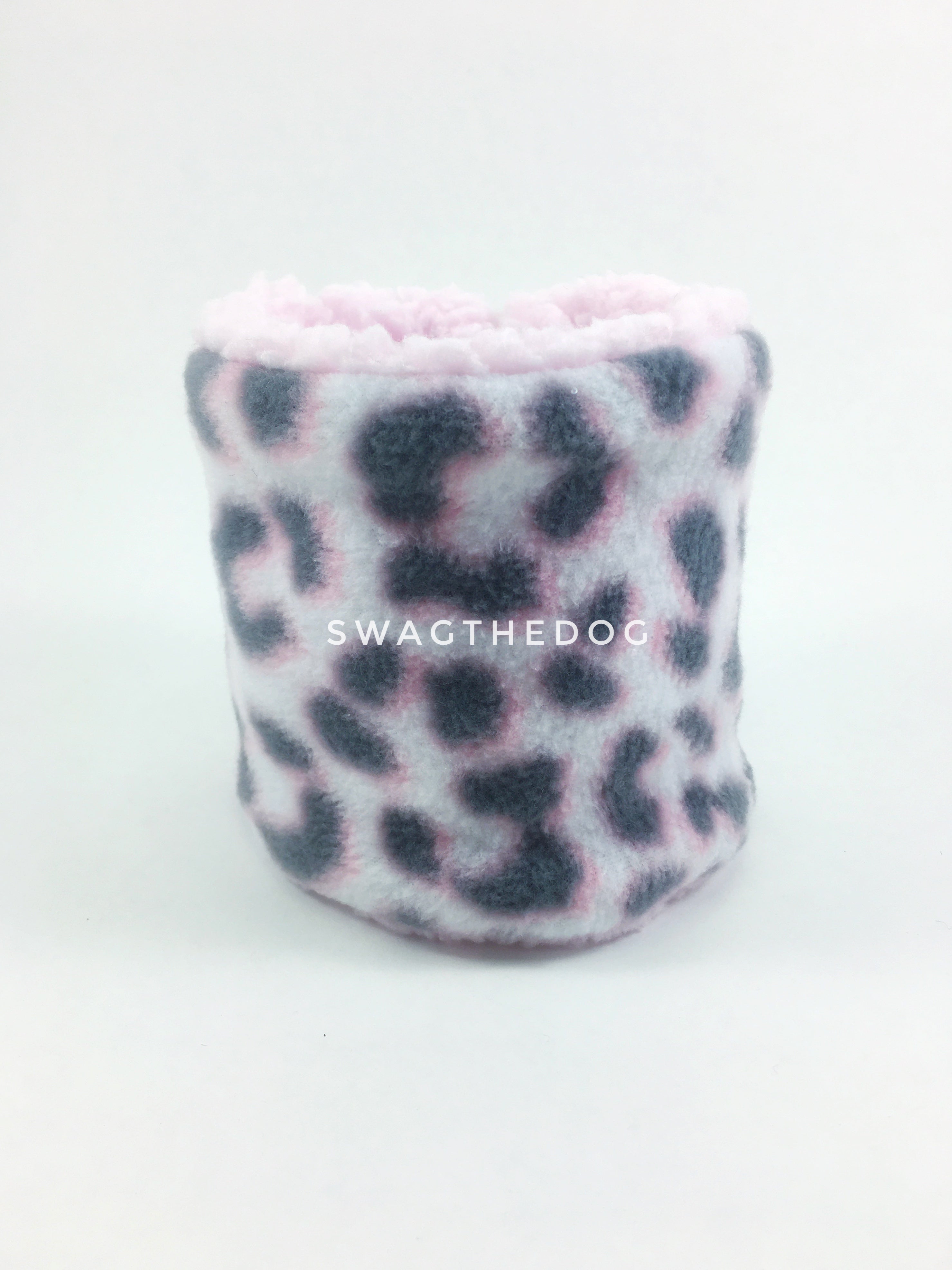 Pink Snow Leopard Swagsnood - Product Front View. Pink snow leopard print fleece Dog Snood and pink sherpa peeking out