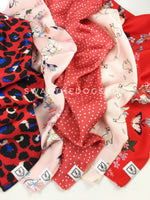 Take an advantage of 3 for $30 deal. 5 Shades of Red/Pink/Coral Color Theme Swagdana Scarves displayed. 1-Fierce Vibrant Red with Blue. 2-Pink Wild Flower. 3-Polka Itty Bitty Coral. 4-Lorenzo Llama Pink. 5-Red Wild Flower. Dog Bandana. Dog Scarf