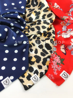 Take an advantage of 3 for $30 deal. Three Blue/White/Red colored Theme Swagdana Scarves displayed. 1-Polka Dot Navy. 2-Fierce Beige with Yellow. 3-Red Wild Flower. Dog Bandana. Dog Scarf