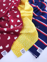 Take an advantage of 3 for $30 deal. Three off-white Swagdana Scarves displayed. 1-Full of Heart Burgundy Cream. 2-Polka Itty Bitty Sunny Yellow. 3-Afternoon in Paris. Dog Bandana. Dog Scarf