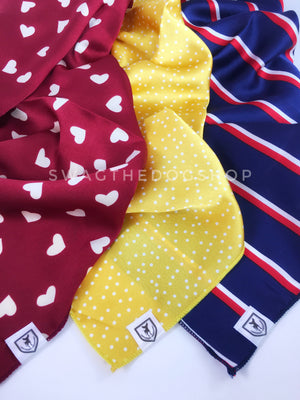 Take an advantage of 3 for $30 deal. 3 Red/ Yellow/ Blue color theme Swagdana Scarves displayed. 1-Full of Heart Burgundy Cream. 2-Polka Itty Bitty Sunny Yellow. 3-Afternoon in Paris. Dog Bandana. Dog Scarf