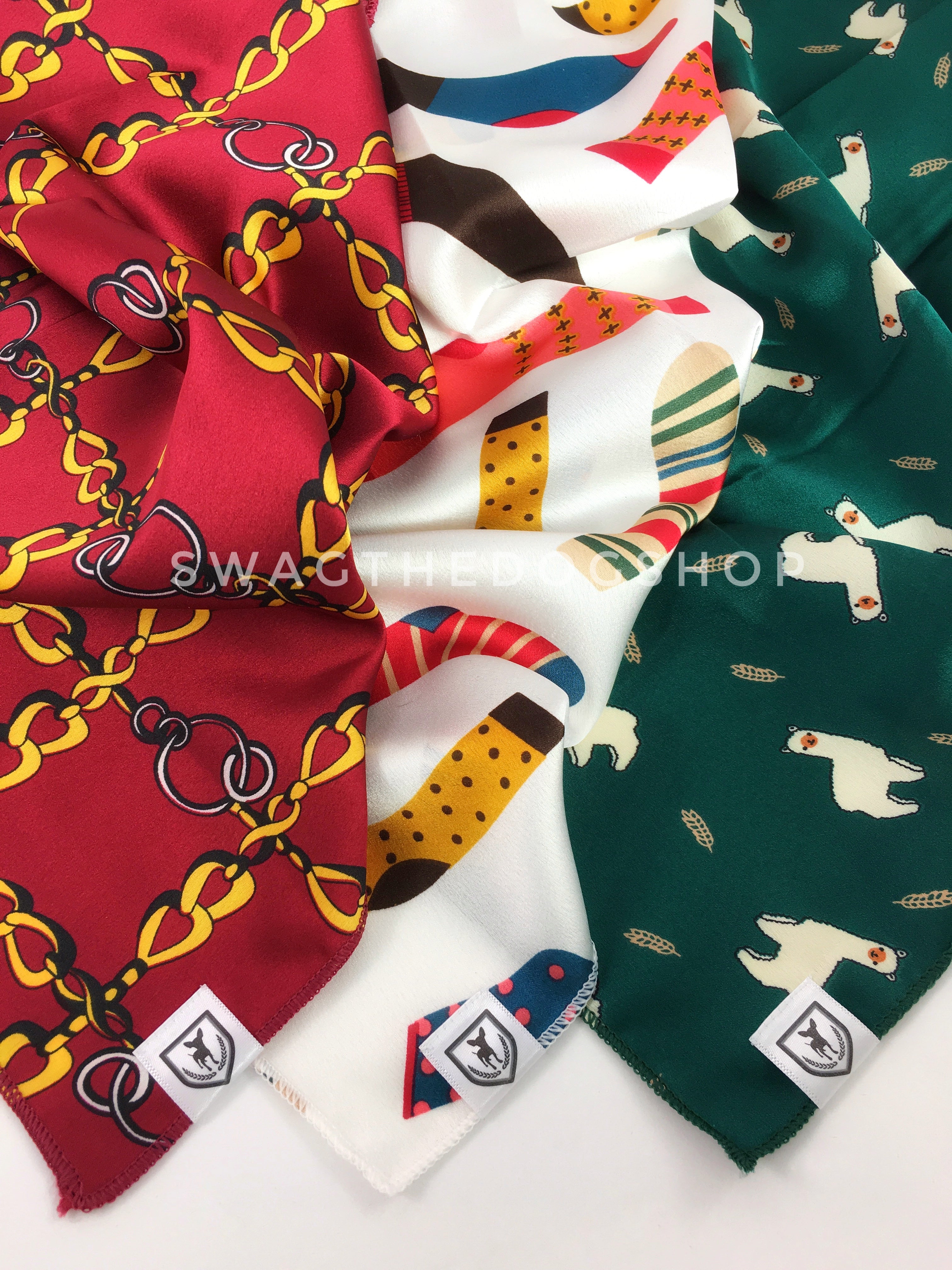 Take an advantage of 3 for $30 deal. 3 Red/ White/ Green color theme Swagdana Scarves displayed. 1-24K Burgundy Gold. 2-Rock Your Socks. 3-Lorenzo Llama Green. Dog Bandana. Dog Scarf