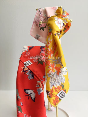 Take an advantage of 3 for $30 deal. 3 Wild Flower Swagdana Scarves displayed hanging. 1-Red Wild Flower. 2-Pink Wild Flower. 3-Yellow Wild Flower. Dog Bandana. Dog Scarf